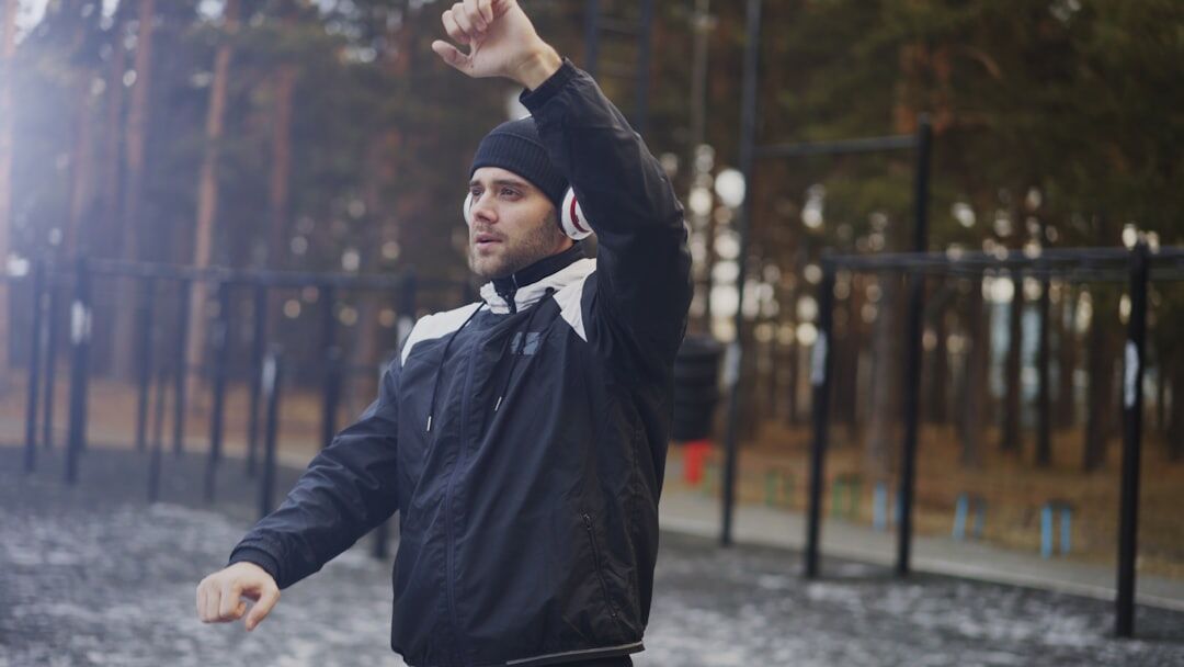 listener with headphones outdoors