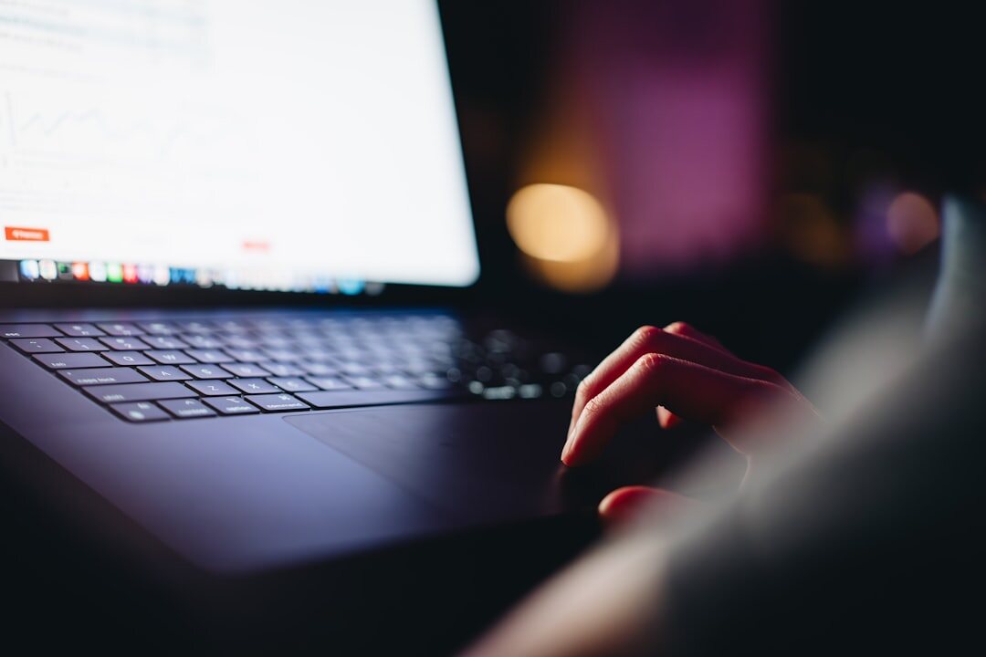 writer typing on laptop