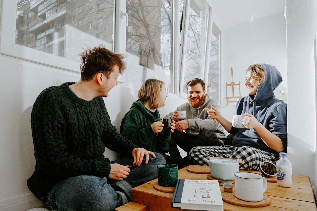 group of friends listening to podcast