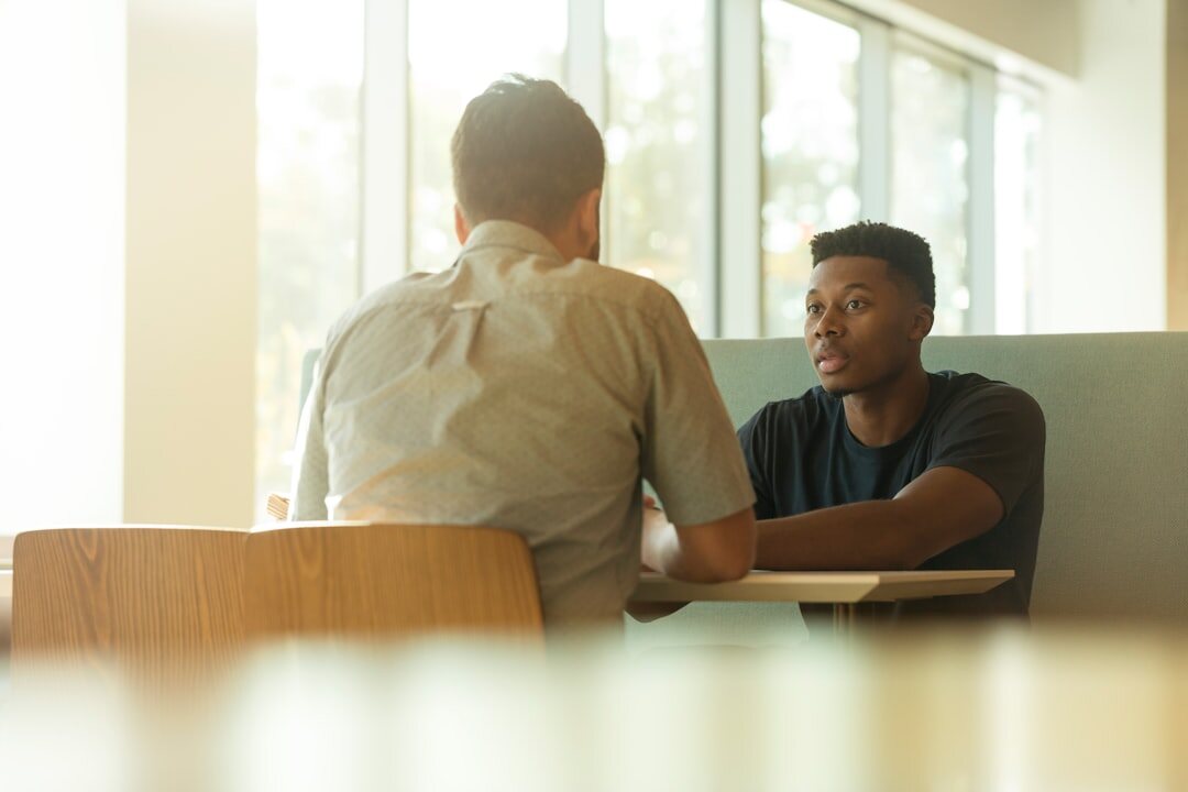two people discussing ideas